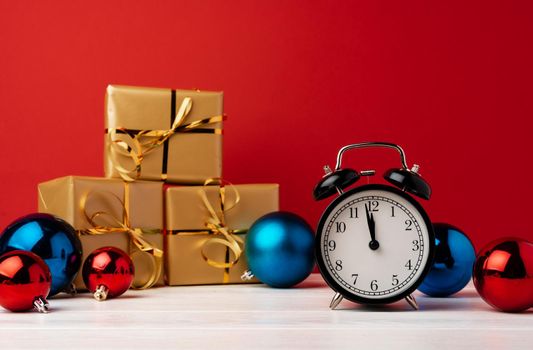 Christmas and New Year celebration countdown concept with alarm clock