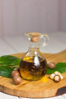 Macadamia oil in a glass bottle. Great photo for your needs.