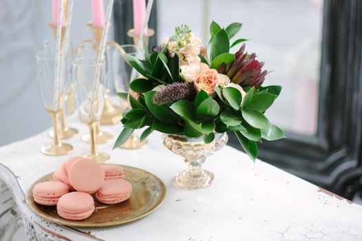 Macaroons and flower bouquet as wedding decoration