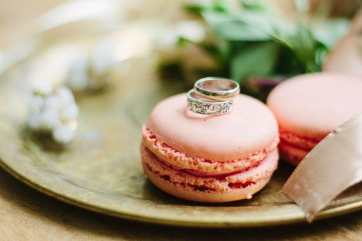 Wedding rings on a macaroon cakes as wedding decoration