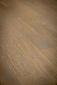 Dark brown wooden parquet floor texture as background.