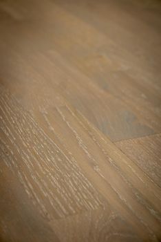 Dark brown wooden parquet floor texture as background.