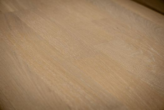 Dark brown wooden parquet floor texture as background.