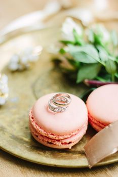 Wedding rings on a macaroon cakes as wedding decoration