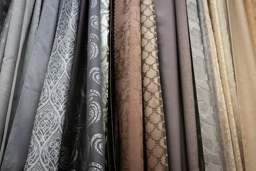 Curtains of different colors and styles in the shop.