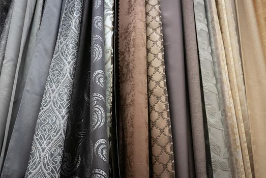 Curtains of different colors and styles in the shop.