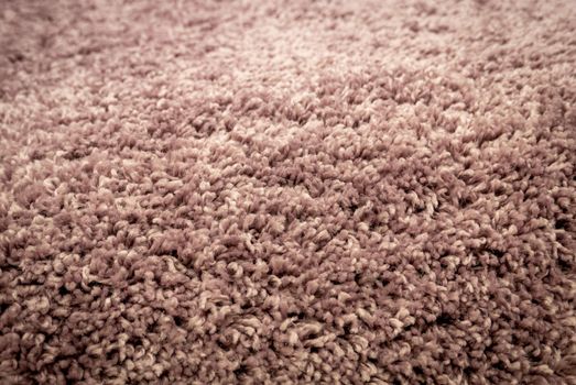 Close up view of carpet. Wall-to-wall carpeting background