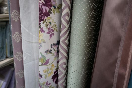 Fabric materials in a shop. Curtains at market