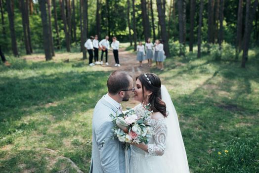 Wedding photography kiss bride and groom in different locations.