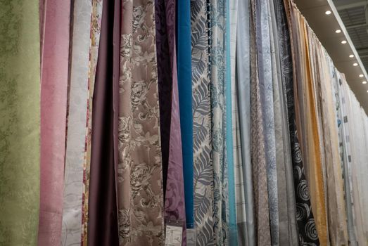Curtains of different colors and styles in the shop.