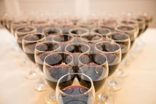 Glasses with alcohol, wine and different drinks on the table