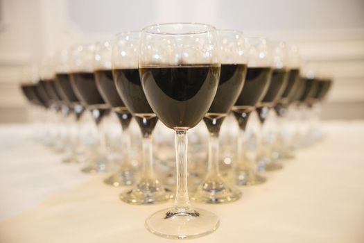 Glasses with alcohol, wine and different drinks on the table