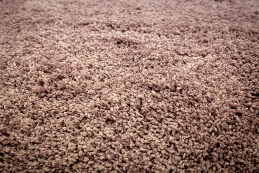 Close up view of carpet. Wall-to-wall carpeting background