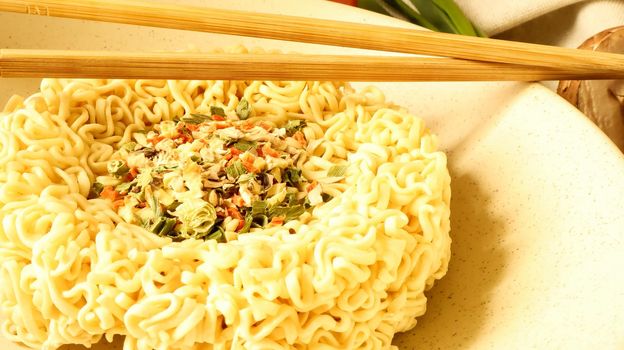instant noodles with dry seasoning brown bowl, raw noodles. Vegetarian dish. Delicious Asian style dinner. pasta, for the preparation of which it is enough to pour boiling water and wait.