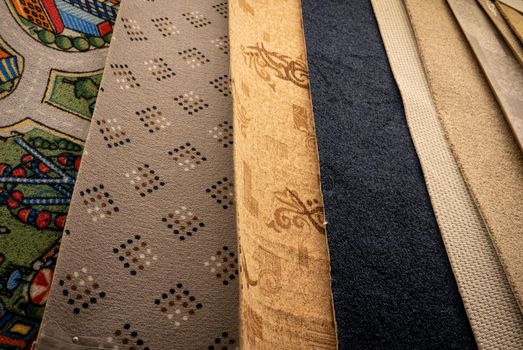 Lot of different carpets in a construction mall.
