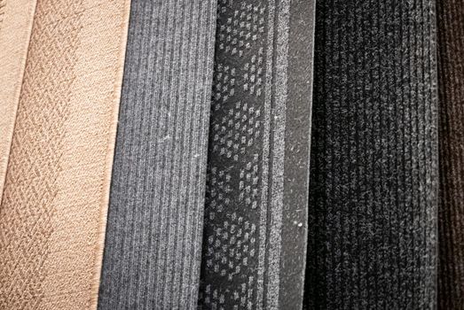 Lot of different carpets in a construction mall.