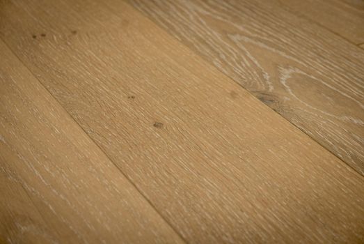 Dark brown wooden parquet floor texture as background.
