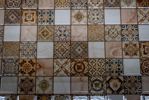 Small tiles of ceramic mosaic on the wall.