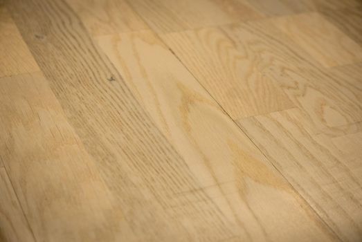 Dark brown wooden parquet floor texture as background.