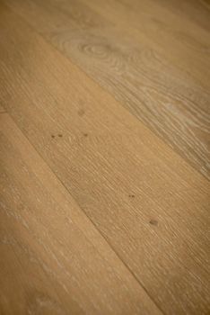 Dark brown wooden parquet floor texture as background.