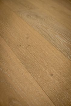 Dark brown wooden parquet floor texture as background.