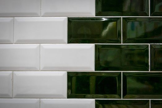 Green and white ceramic bricks on the wall.