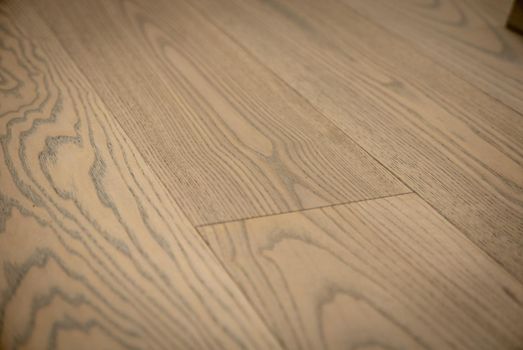 Dark brown wooden parquet floor texture as background.