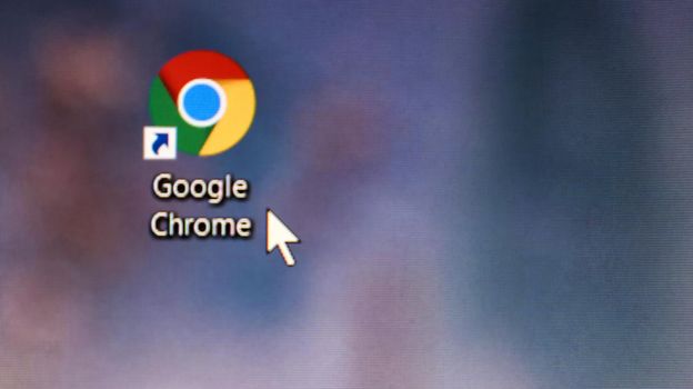Ukraine, Kiev - April 23, 2020. Close-up of the icon of the Google Chrome browser application on the desktop of a computer screen. The mouse cursor is over the shortcut to the Internet browser