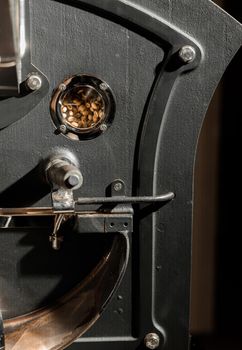 Coffee processing. Roastery, roasting machine and fresh beans