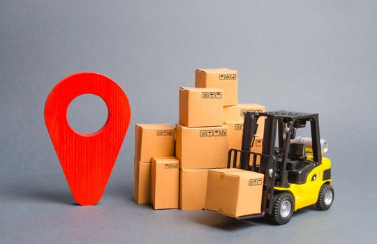 Yellow Forklift truck with cardboard boxes and a red position pin. Locating packages and goods. Tracking parcels via the Internet. Algorithm for constructing a minimum route for the delivery of orders