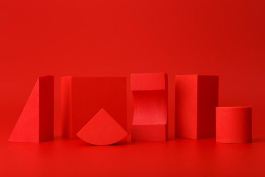 Abstract trendy futuristic background in monochromatic red colors with copy space. Bright artsy background with different geometric shapes on red background
