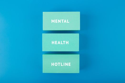 Mental health hotline minimal concept in blue monochromatic colors. Mental health awareness, help and assistance concept