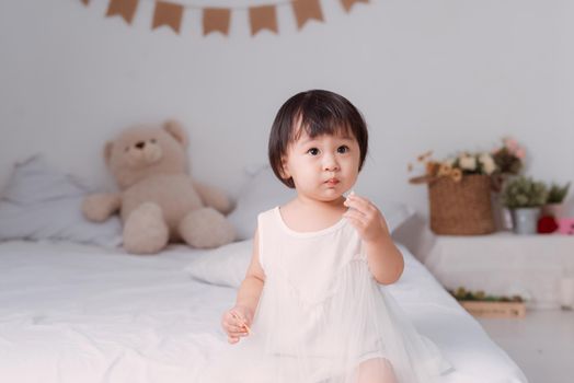 portrait of happy, positive, smiling, playful asian little girl