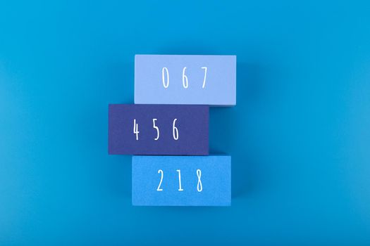 Squid Game Korean movie concept. Squid Game Korean movie concept. People numbers on rectangles on blue background. Minimal background with Squid Game movie numbers 067, 456, 218