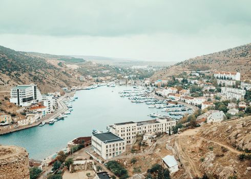 Resort town around sea bay and marine station of yachts and boats.