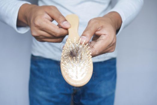 man hold his list hair close up ,