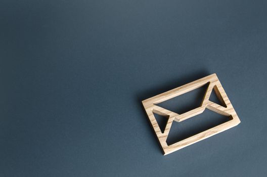 Wooden letter envelope. Contact concept. Postal correspondence. Mail notification. Communication internet technologies. Email. Business representations on the Internet and social media. Feedback