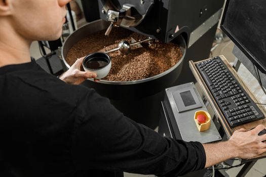 Coffee processing. Roastery, roasting machine and fresh beans