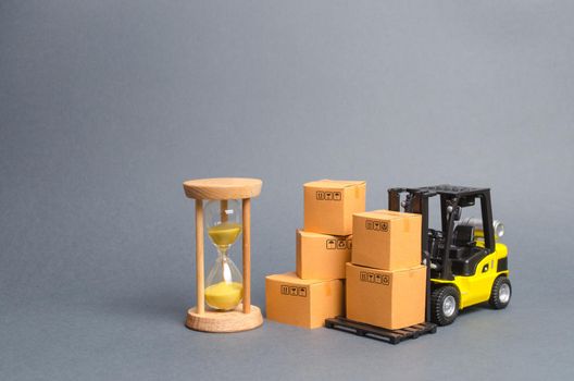 Yellow Forklift truck with cardboard boxes and a sand hourglass. Express delivery concept. Optimization of logistics and delivery, improving efficiency. Temporary storage, limited offer and discount.