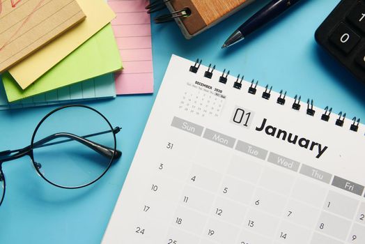 January month on calendar on office desk.