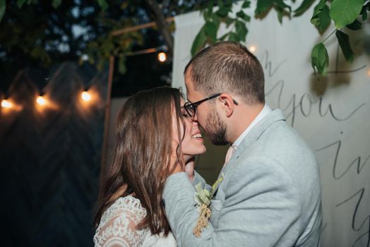 Wedding photography kiss bride and groom in different locations.