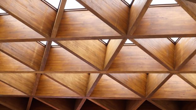 Luxurious geometric wooden triangles in construction. The concept of modern architecture, design and interior. Wood background. Modular canopy or roof