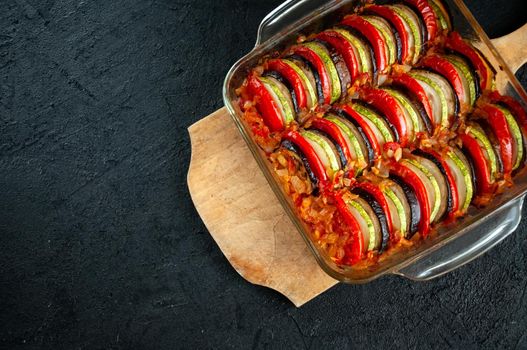 Ratatouille - Traditional Dish Of Provencal Cuisine. Healthy Vegetable Food. Dark Stone Background.