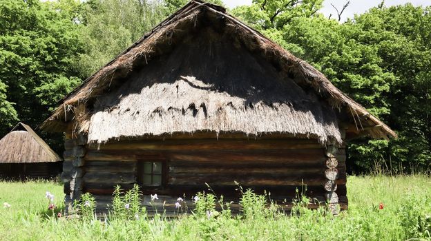 Ukraine, Kiev - June 11, 2020. The old house of peasants in the museum Pirogovo. National Museum of Folk Architecture and Everyday Life of Traditional Folklore Houses of Different Regions of Ukraine.
