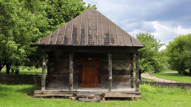 Ukraine, Kiev - June 11, 2020. The old house of peasants in the museum Pirogovo. National Museum of Folk Architecture and Everyday Life of Traditional Folklore Houses of Different Regions of Ukraine.