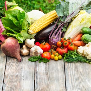 Various vegetables on a wooden table with copy space