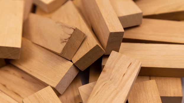 The texture of a pile of wooden blocks that lie randomly. Background
