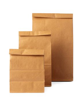 Brown craft paper bag packaging template on white background close up