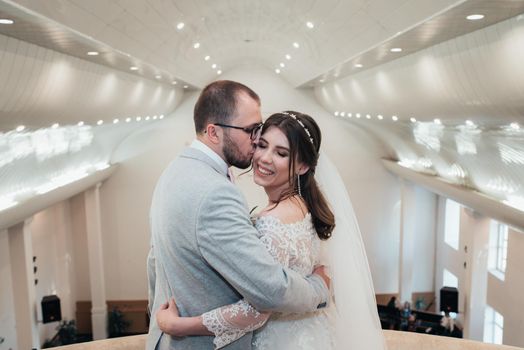 Wedding photography kiss bride and groom in different locations.