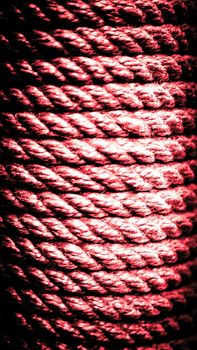 Vertical old red rope background. Rope texture. Close-up rope texture.